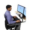 Ergotron WorkFit-S Dual, Black Colour, Side View, Lowered Workstation, Office Usage, Person Typing, Man Sitting, Keyboard, Mouse, Two Monitors