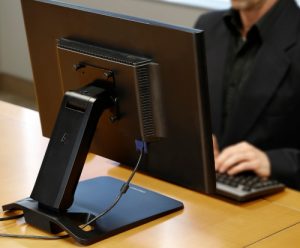 Ergotron Neo-Flex® Touchscreen Stand, Back View, Black Colour, Monitor Attached, Person Typing
