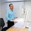 ERgotron Workfit-SR Sit to Stand Desk in use Standing